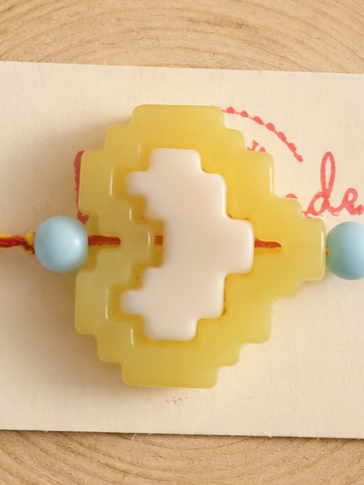 BeYoou.Bling Handcrafted Pastel Yellow & White Rakhi with Pixel Heart Centre Charm